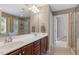 Bathroom with double sink vanity, walk-in glass shower, and tiled floors at 846 Lake Artesia Ln, Fuquay Varina, NC 27526