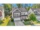 Charming two-story home with a well-maintained lawn and attached two-car garage at 846 Lake Artesia Ln, Fuquay Varina, NC 27526