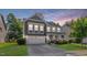 Charming two-story home boasts manicured lawn and a two-car garage at 846 Lake Artesia Ln, Fuquay Varina, NC 27526