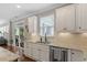 Bright kitchen featuring stainless steel appliances, granite countertops, and sliding door at 846 Lake Artesia Ln, Fuquay Varina, NC 27526