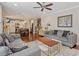 Spacious living room with hardwood floors flows into the kitchen at 846 Lake Artesia Ln, Fuquay Varina, NC 27526