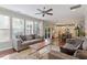 Open concept living room with hardwood floors flows into the kitchen at 846 Lake Artesia Ln, Fuquay Varina, NC 27526