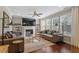 Cozy living room with fireplace, hardwood floors, and lots of natural light at 846 Lake Artesia Ln, Fuquay Varina, NC 27526