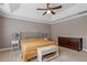 Bright main bedroom features tray ceiling, neutral decor, and lots of natural light at 846 Lake Artesia Ln, Fuquay Varina, NC 27526