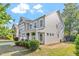 Two-story home showcasing manicured landscaping and inviting curb appeal at 846 Lake Artesia Ln, Fuquay Varina, NC 27526