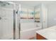 Bathroom featuring a shower, tub, and lovely decor at 8640 Neuse Landing Ln # 110, Raleigh, NC 27616