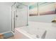 Bathroom featuring a shower, tub, and lovely decor at 8640 Neuse Landing Ln # 110, Raleigh, NC 27616