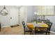 Inviting dining area with a round wooden table, chairs, and natural light at 8640 Neuse Landing Ln # 110, Raleigh, NC 27616