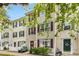 Attractive townhome with red shutters, white trim, and a well-manicured lawn at 8640 Neuse Landing Ln # 110, Raleigh, NC 27616
