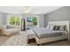 Expansive main bedroom with large windows, lots of seating, and TV at 8640 Neuse Landing Ln # 110, Raleigh, NC 27616