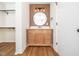 Bathroom with wood vanity, round mirror with lights, offering style and functionality at 8731 Raleigh, Benson, NC 27504