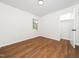 Bright bedroom with hardwood flooring and a closet, offering a cozy and inviting space at 8731 Raleigh, Benson, NC 27504