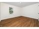 Inviting bedroom featuring hardwood floors and a window, creating a serene atmosphere at 8731 Raleigh, Benson, NC 27504