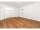 Bedroom with wood floor, closet, and natural light, providing comfort and style at 8731 Raleigh, Benson, NC 27504