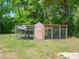 Chicken coop in the backyard, great for raising chickens in a secure and spacious environment at 8731 Raleigh, Benson, NC 27504
