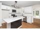 Modern kitchen featuring white cabinets, quartz countertops, and stainless steel appliances at 8731 Raleigh, Benson, NC 27504