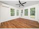 Sunroom with multiple windows providing natural light and wood floors with a ceiling fan at 8731 Raleigh, Benson, NC 27504