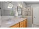 Elegant bathroom with double sinks, granite countertops, and a glass-enclosed shower at 9625 Collins Creek Dr, Chapel Hill, NC 27516