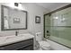 Bathroom featuring a marble countertop vanity and a modern glass shower at 9625 Collins Creek Dr, Chapel Hill, NC 27516
