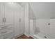 Modern bathroom with a tiled shower and built-in storage cabinets at 9625 Collins Creek Dr, Chapel Hill, NC 27516