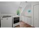 Well-equipped laundry room featuring modern appliances and ample cabinet space at 9625 Collins Creek Dr, Chapel Hill, NC 27516