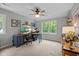 Bright office space with a ceiling fan, large window, desk, and shelving at 9625 Collins Creek Dr, Chapel Hill, NC 27516
