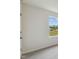 This bedroom features a window with natural light and neutral colored carpeting at 0 Greensboro Chapel Hill Road Rd, Graham, NC 27253