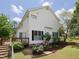 Back exterior showing a deck and flowering bushes at 101 Cardinal Dr, Youngsville, NC 27596