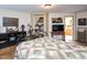 Bright bedroom featuring a bed with quilt, hardwood floors, and easy access to bathroom at 101 Cardinal Dr, Youngsville, NC 27596