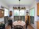 Bright dining room showcases a round table with charming accents and natural light pouring in from the windows at 101 Cardinal Dr, Youngsville, NC 27596