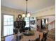 Charming dining room with a wooden table, decorative accents, and natural light at 101 Cardinal Dr, Youngsville, NC 27596