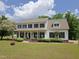 Beautiful two-story home featuring a large front yard, covered porch, and classic curb appeal at 101 Cardinal Dr, Youngsville, NC 27596