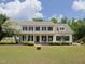 Charming two-story home featuring a welcoming front porch and well-manicured landscaping at 101 Cardinal Dr, Youngsville, NC 27596
