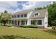 Inviting home showcasing a sprawling front yard, covered porch, and attached garage at 101 Cardinal Dr, Youngsville, NC 27596