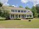 Attractive two-story home with a covered front porch, lush landscaping, and inviting appeal at 101 Cardinal Dr, Youngsville, NC 27596