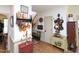 Inviting hallway with hardwood floors, decorative shelves, and charming country decor throughout the home at 101 Cardinal Dr, Youngsville, NC 27596