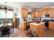 Inviting kitchen with wood cabinets, an island, and a breakfast nook with natural light at 101 Cardinal Dr, Youngsville, NC 27596