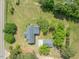 Aerial view of the property with home, garage, and expansive green lawn at 10186 W Nc-97 Hwy, Middlesex, NC 27557