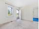 Bright bedroom featuring neutral carpet, and an open doorway at 10186 W Nc-97 Hwy, Middlesex, NC 27557
