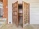 Close-up view of double wooden doors in the carport area at 10186 W Nc-97 Hwy, Middlesex, NC 27557