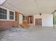 Covered carport area with brick accents and double doors at 10186 W Nc-97 Hwy, Middlesex, NC 27557