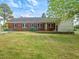 Spacious brick home with a manicured lawn, dark shutters, and a well-maintained front yard at 10186 W Nc-97 Hwy, Middlesex, NC 27557