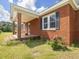 The porch is red brick and has a tile floor and leads into the front door of the house at 10186 W Nc-97 Hwy, Middlesex, NC 27557
