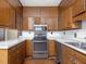 Kitchen featuring light countertops, stainless steel appliances, and wood cabinets at 10186 W Nc-97 Hwy, Middlesex, NC 27557