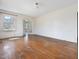 Bright, empty living room with hardwood floors and French doors, ready for personalization and modern living at 10186 W Nc-97 Hwy, Middlesex, NC 27557