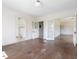 Open-concept living room with hardwood floors and multiple doorways, offering a versatile and spacious layout at 10186 W Nc-97 Hwy, Middlesex, NC 27557