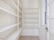 Organized pantry features multiple shelves for ample storage, bathed in natural light from a window at 10186 W Nc-97 Hwy, Middlesex, NC 27557