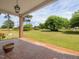 Covered front porch view showcasing decorative tile floor and spacious area, perfect for outdoor relaxation at 10186 W Nc-97 Hwy, Middlesex, NC 27557