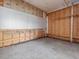 Unfinished room with brick and wood walls and a concrete floor at 10186 W Nc-97 Hwy, Middlesex, NC 27557
