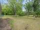 Expansive yard with mature trees provides ample space for outdoor activities at 10186 W Nc-97 Hwy, Middlesex, NC 27557